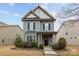 Charming two-story home boasts manicured landscaping and classic architectural details at 1710 Woodward Ave, Charlotte, NC 28206
