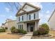 Attractive two-story home with lush front yard landscaping and welcoming entrance at 1710 Woodward Ave, Charlotte, NC 28206