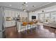 Open-concept kitchen with bar seating, stainless steel appliances, and seamless flow at 1710 Woodward Ave, Charlotte, NC 28206