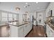 Bright eat-in kitchen with granite island and stainless appliances is open to the living area at 1710 Woodward Ave, Charlotte, NC 28206