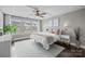 Bright main bedroom with large windows, stylish decor, and a neutral color scheme at 1710 Woodward Ave, Charlotte, NC 28206