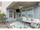 Relaxing outdoor patio features a seating area, ceiling fan, and barbecue grill at 1710 Woodward Ave, Charlotte, NC 28206
