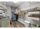 Spacious walk-in closet with ample shelving, hanging rods, and organized storage solutions at 1710 Woodward Ave, Charlotte, NC 28206
