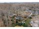 Overhead shot of home highlighting the surrounding trees and neighborhood at 1715 Shagbark Ln, Charlotte, NC 28226