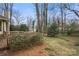Backyard featuring a wooden deck, a mature tree and a foliage at 1715 Shagbark Ln, Charlotte, NC 28226