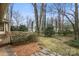 Backyard featuring a wooden deck, a mature tree and a foliage at 1715 Shagbark Ln, Charlotte, NC 28226