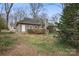 Backyard featuring a patio, stairs, and mature trees at 1715 Shagbark Ln, Charlotte, NC 28226