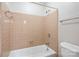 Bathroom with shower-tub, tile surround and chrome fixtures at 1715 Shagbark Ln, Charlotte, NC 28226