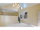 Elegant dining room features a chandelier and plenty of natural light from a large window at 1715 Shagbark Ln, Charlotte, NC 28226