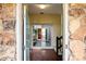 View from the front door into the foyer with hardwood floors and access to back patio at 1715 Shagbark Ln, Charlotte, NC 28226