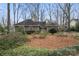Charming single-story home features a well-manicured front yard and a striking blue front door at 1715 Shagbark Ln, Charlotte, NC 28226