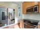The kitchen features modern appliances and access to a private outdoor patio at 1715 Shagbark Ln, Charlotte, NC 28226