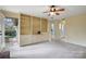 The living room features built-in shelving and access to an outdoor deck at 1715 Shagbark Ln, Charlotte, NC 28226