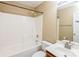 Well-maintained bathroom features a shower-tub combo, vanity with mirror, and neutral finishes at 2019 W Laporte Dr, Charlotte, NC 28216