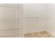 Walk-in closet offers ample storage space with built-in shelving at 2019 W Laporte Dr, Charlotte, NC 28216