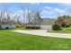 Exterior view of the house with a shed, garage, and well-manicured yard at 2019 W Laporte Dr, Charlotte, NC 28216