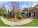 Beautiful brick home exterior with mature landscaping, sidewalk, and well-maintained front yard at 2019 W Laporte Dr, Charlotte, NC 28216