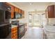 Bright kitchen features wooden cabinets, modern appliances and a sunlit breakfast nook with large windows at 2019 W Laporte Dr, Charlotte, NC 28216