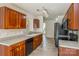 Functional kitchen with wood cabinetry, tile floor, and ample countertop space at 2019 W Laporte Dr, Charlotte, NC 28216