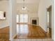 Bright living room with beautiful floors, fireplace, ceiling fan and natural light at 2019 W Laporte Dr, Charlotte, NC 28216