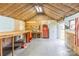 Shed interior with workbench, tools, and insulation at 2019 W Laporte Dr, Charlotte, NC 28216