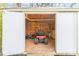 Shed with open door and lawn care equipment inside at 2019 W Laporte Dr, Charlotte, NC 28216