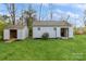 Two sheds with open doors in a grassy backyard, providing ample storage space at 2019 W Laporte Dr, Charlotte, NC 28216