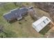 High angle view of a home featuring an outdoor patio, detached garage and verdant lawn at 218 Countryside Rd, Kings Mountain, NC 28086