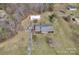 Top-down view showing property, landscaping and detached garage amid the surrounding trees and foliage at 218 Countryside Rd, Kings Mountain, NC 28086