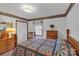 Comfortable bedroom with soft lighting, cozy quilt, and classic wooden furniture at 218 Countryside Rd, Kings Mountain, NC 28086