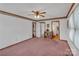 Large bedroom with light pink carpet, two entryways, and decorative border along the ceiling at 218 Countryside Rd, Kings Mountain, NC 28086