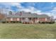 Charming brick home with a covered front porch and beautifully maintained lawn and garden at 218 Countryside Rd, Kings Mountain, NC 28086