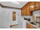Functional laundry room includes a washer, dryer, and sink for added convenience at 218 Countryside Rd, Kings Mountain, NC 28086