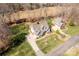 Expansive aerial displays a light green home enveloped in lush greenery, highlighting its spacious surroundings at 233 Catawba Crest Ln, Clover, SC 29710