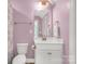 Well-lit lavender bathroom with a single vanity, white fixtures, and classic fixtures at 233 Catawba Crest Ln, Clover, SC 29710