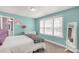 Inviting bedroom with natural light, white dresser, and relaxing aqua-painted walls at 233 Catawba Crest Ln, Clover, SC 29710