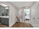 Hallway with views of a full bathroom, stairs and bedroom, featuring wood flooring at 233 Catawba Crest Ln, Clover, SC 29710