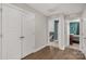 Hallway entrance featuring wood flooring, multiple closets, and an open view to bedrooms and living spaces at 233 Catawba Crest Ln, Clover, SC 29710