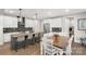 Spacious kitchen with an island and bar seating adjacent to the dining area at 233 Catawba Crest Ln, Clover, SC 29710