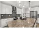 Modern kitchen with granite countertops, a kitchen island with a sink, and stainless steel appliances at 233 Catawba Crest Ln, Clover, SC 29710