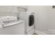 Bright laundry room with modern LG washer and dryer, plus built-in shelving for organized storage at 233 Catawba Crest Ln, Clover, SC 29710