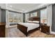 Serene main bedroom with tray ceilings, large windows, and cozy decor at 233 Catawba Crest Ln, Clover, SC 29710
