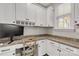 Bright office space with granite countertops, white cabinetry, and natural light from the window at 233 Catawba Crest Ln, Clover, SC 29710