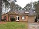 Charming single-story home featuring tan siding, red shutters, and an attached one car garage at 2517 Bushy Pine Ct, Charlotte, NC 28273