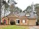 Charming single-story home featuring tan siding, red shutters, and an attached one car garage at 2517 Bushy Pine Ct, Charlotte, NC 28273