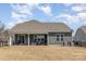 Exterior home view with covered patio and spacious backyard area at 3002 Paddington Dr, Indian Trail, NC 28079