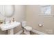 A half bath features a pedestal sink and commode at 3002 Paddington Dr, Indian Trail, NC 28079