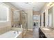 Bathroom with a soaking tub, shower, granite counters and tile surround at 3002 Paddington Dr, Indian Trail, NC 28079