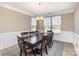 Elegant dining room featuring hardwood floors, crown molding, and a stylish table at 3002 Paddington Dr, Indian Trail, NC 28079