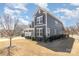 Charming two-story home with gray siding, white trim, and well-manicured landscaping at 3002 Paddington Dr, Indian Trail, NC 28079